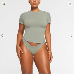 SKIMS COTTON JERSEY T-SHIRT IN MINERAL